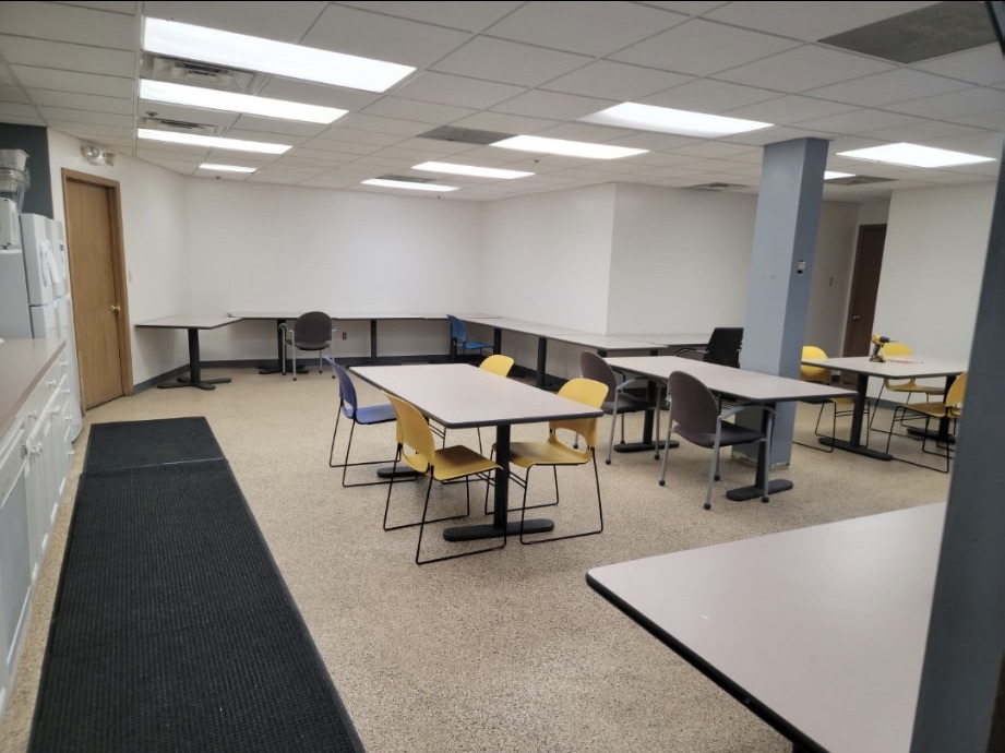 Same break room after a seamless tan flake epoxy floor installation