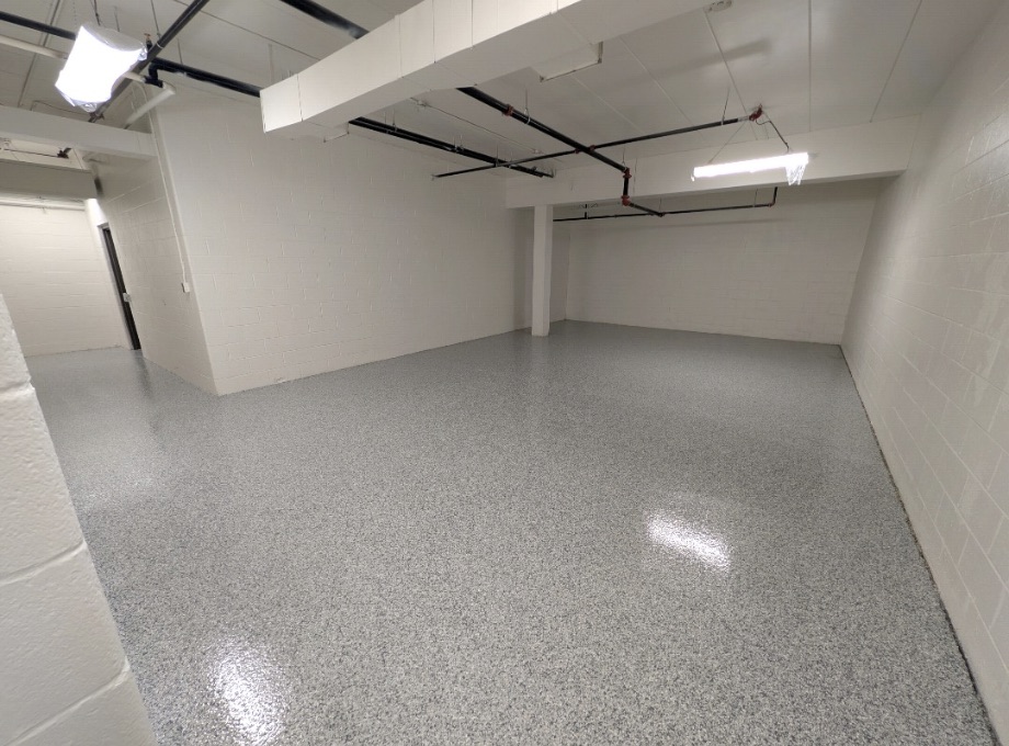 Gray flake epoxy floor coating in a bright commercial storage room in Cuyahoga Falls, Ohio